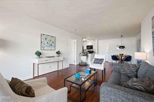 living room with dark wood-type flooring