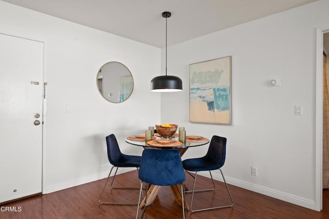 dining room featuring dark wood-type flooring