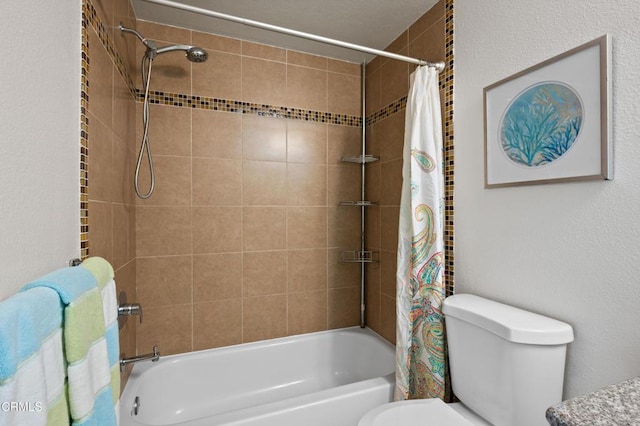 bathroom with toilet and shower / tub combo