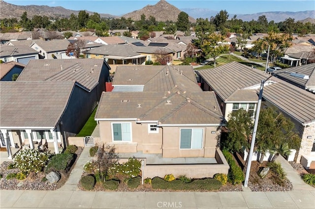 birds eye view of property featuring a mountain view