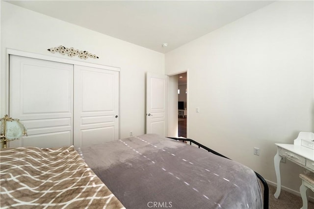 carpeted bedroom with a closet