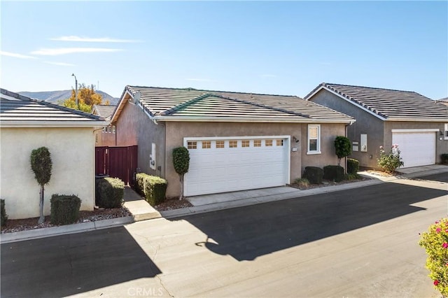 ranch-style house featuring a garage