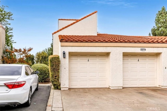 view of side of property with a garage