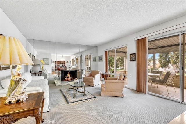 carpeted living room with a textured ceiling