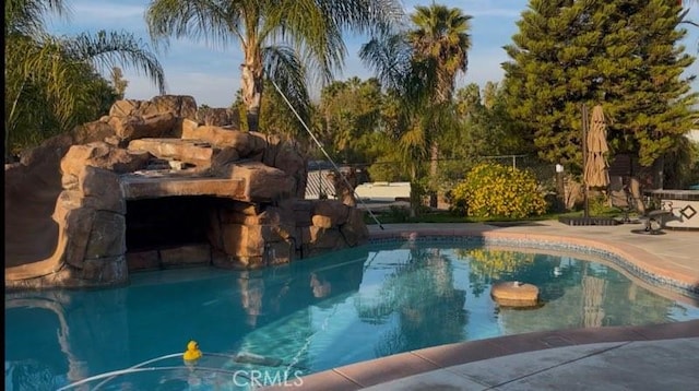 view of pool featuring a patio