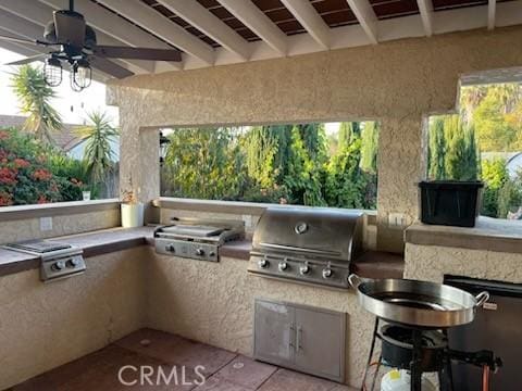 view of patio / terrace featuring ceiling fan, grilling area, and area for grilling