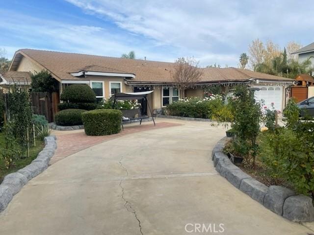 single story home featuring a garage