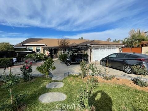 single story home with a front lawn and a garage