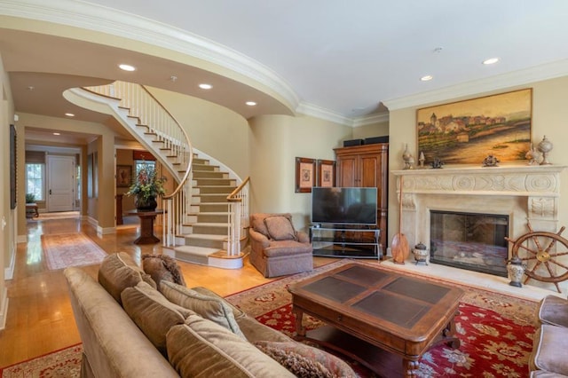 living room with crown molding and hardwood / wood-style flooring