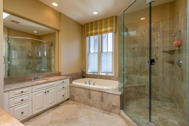 bathroom with vanity and plus walk in shower