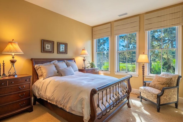 bedroom with light colored carpet