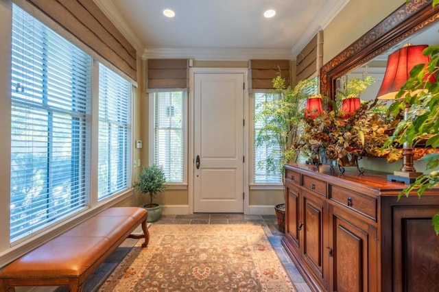 doorway featuring crown molding