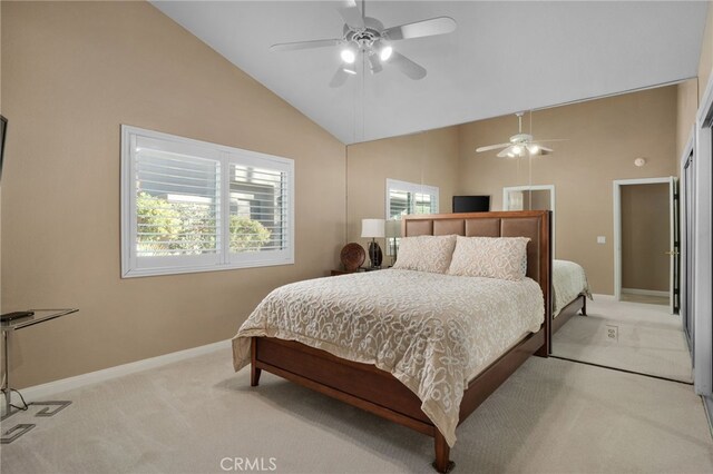 bedroom with light colored carpet, high vaulted ceiling, and ceiling fan