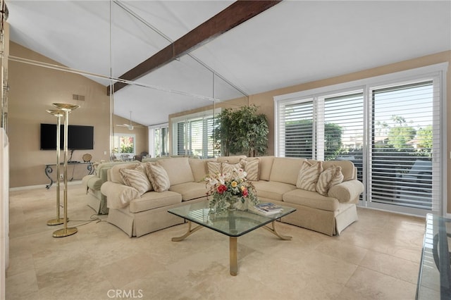 living room featuring beamed ceiling and high vaulted ceiling