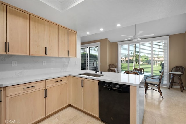 kitchen with kitchen peninsula, light brown cabinets, black dishwasher, and sink