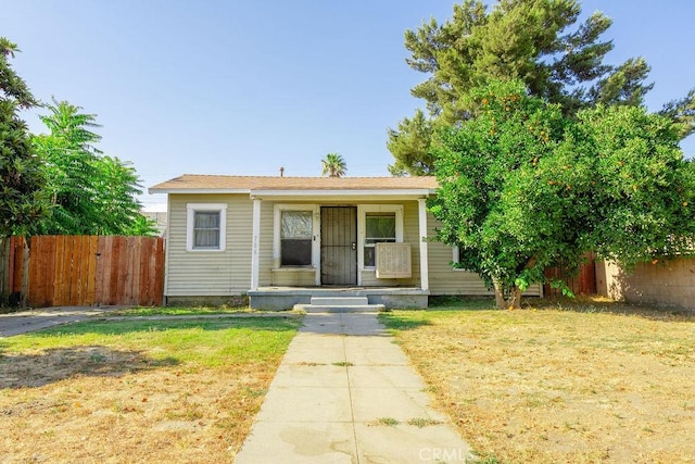 bungalow-style house with a front lawn and a porch