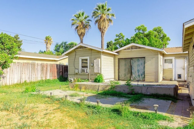 back of house with cooling unit