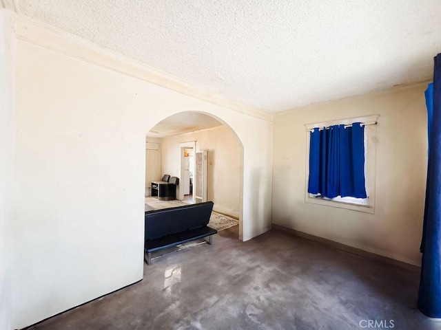 spare room featuring a textured ceiling