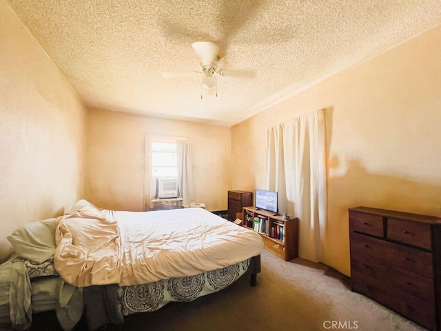 bedroom with carpet flooring, a textured ceiling, ceiling fan, and cooling unit