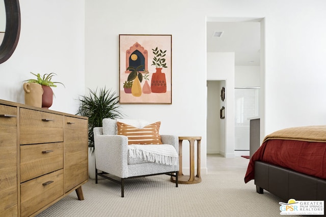 bedroom featuring light colored carpet and baseboard heating