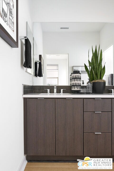 bathroom featuring wood-type flooring and sink