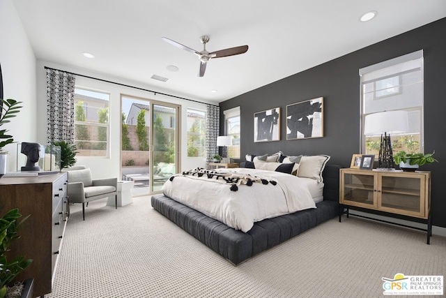 carpeted bedroom featuring access to exterior and ceiling fan