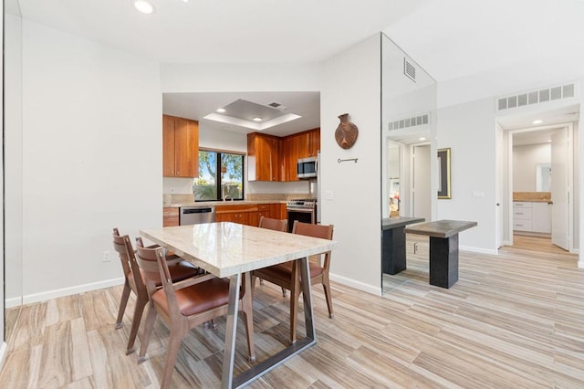 dining area with light hardwood / wood-style floors