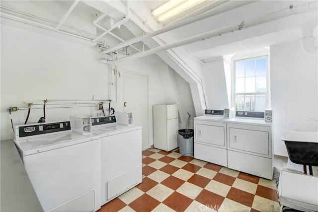 laundry area featuring washer and dryer and sink