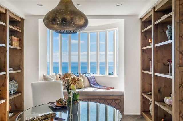sitting room featuring a water view