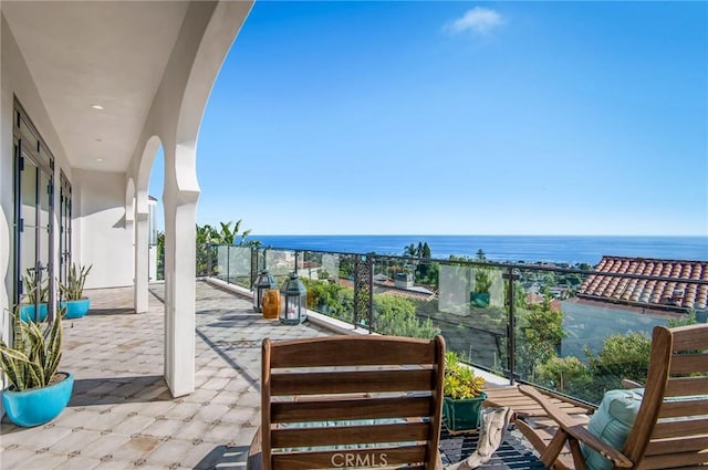 balcony featuring a water view