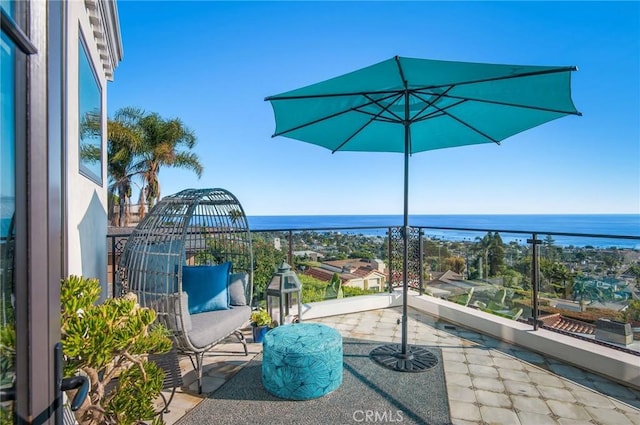 balcony featuring a water view
