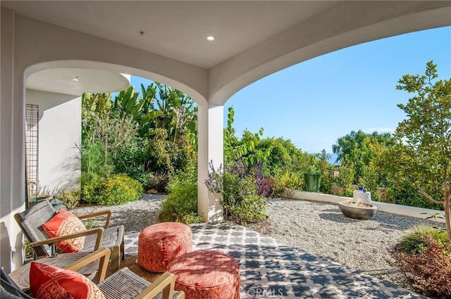 view of patio / terrace featuring an outdoor fire pit