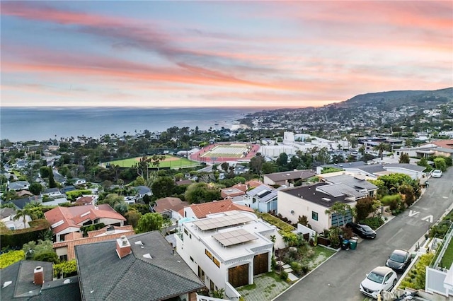 aerial view at dusk with a water view