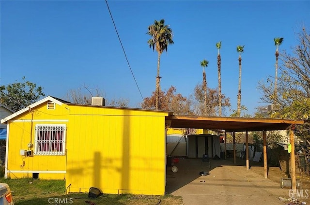 view of outbuilding with a carport