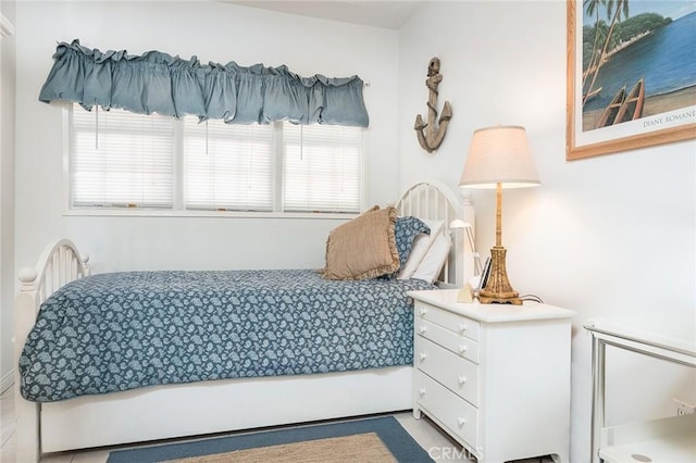 bedroom featuring multiple windows