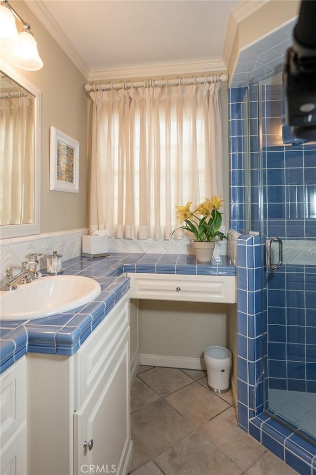 bathroom featuring a wealth of natural light, crown molding, vanity, and a shower with shower door