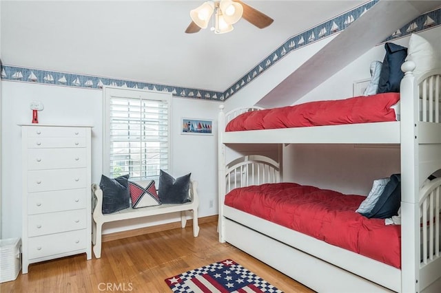 bedroom featuring hardwood / wood-style floors and ceiling fan