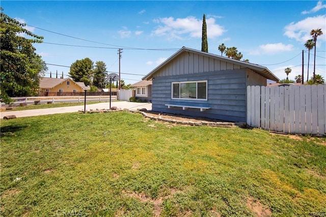 view of property exterior featuring a yard