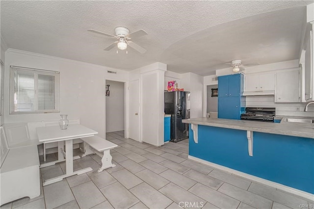 kitchen featuring white cabinetry, sink, black fridge with ice dispenser, ceiling fan, and stove