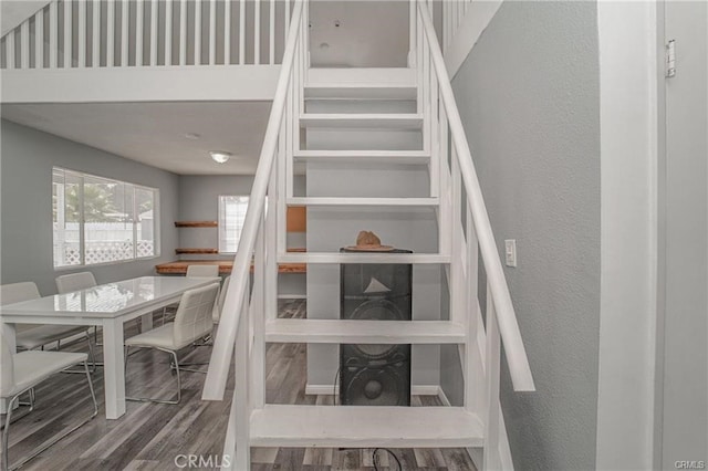 stairs featuring hardwood / wood-style flooring