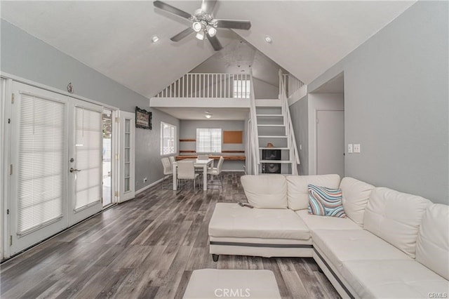 living room featuring french doors, ceiling fan, a wealth of natural light, and hardwood / wood-style floors