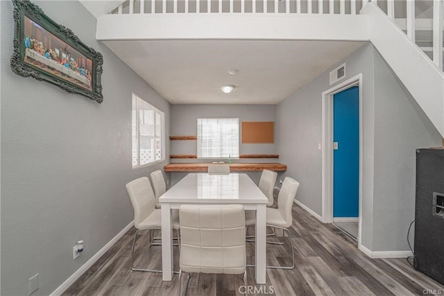 dining room featuring dark hardwood / wood-style flooring and sink