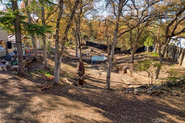 view of yard with a trampoline