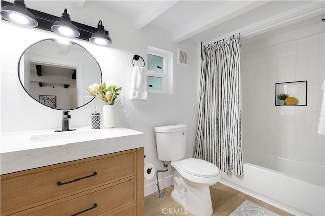 full bathroom featuring hardwood / wood-style flooring, vanity, toilet, and shower / tub combo