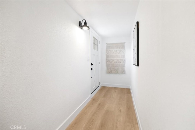 corridor featuring light hardwood / wood-style flooring