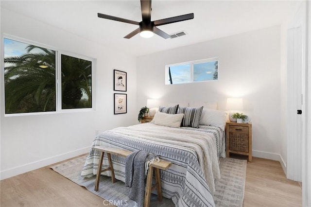 bedroom with light wood-type flooring and ceiling fan