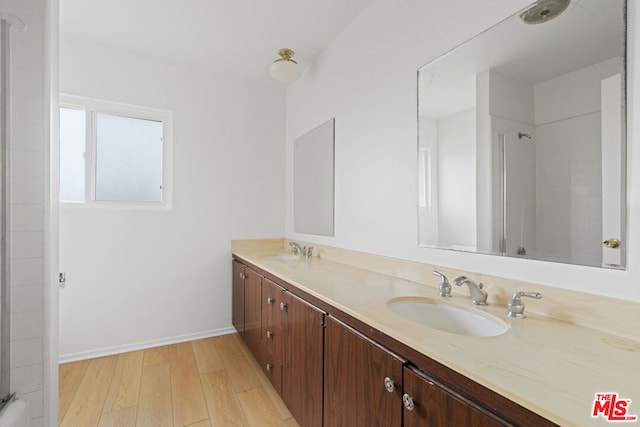 bathroom featuring hardwood / wood-style flooring and vanity