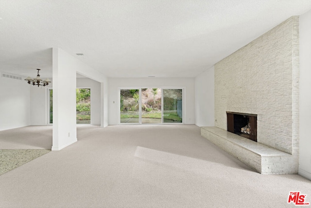 unfurnished living room featuring a stone fireplace, light carpet, and ceiling fan