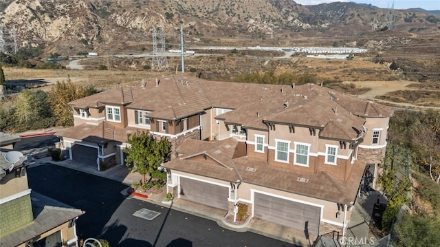 drone / aerial view featuring a mountain view