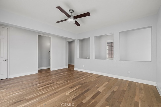 spare room featuring ceiling fan and hardwood / wood-style floors